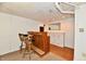 A view of the basement, featuring a built in bar with stools at 7912 E St Joseph St, Indianapolis, IN 46219
