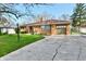 Charming brick home featuring a well-manicured lawn and a two-car garage at 7912 E St Joseph St, Indianapolis, IN 46219