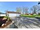 A view of the detached garage with a large parking area at 7912 E St Joseph St, Indianapolis, IN 46219