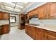 A view of the kitchen featuring marble floors and custom wood cabinets at 7912 E St Joseph St, Indianapolis, IN 46219