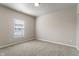 Unfurnished bedroom features neutral walls, carpet, a window and lots of light at 12820 University Cres # 2D, Carmel, IN 46032