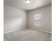 Unfurnished bedroom features neutral walls, carpet, a window and lots of light at 12820 University Cres # 2D, Carmel, IN 46032