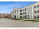 Attractive exterior with classical columns, symmetrical design, black shutters, and well-maintained landscaping at 12820 University Cres # 2D, Carmel, IN 46032