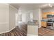 Open concept kitchen features stainless steel appliances, wood cabinets, and laminate countertops at 12820 University Cres # 2D, Carmel, IN 46032