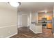 Bright kitchen with granite countertops, wooden cabinets, and stainless steel appliances at 12820 University Cres # 2D, Carmel, IN 46032