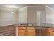 Well-lit kitchen with granite countertops, stainless steel appliances, and modern sink fixture at 12820 University Cres # 2D, Carmel, IN 46032