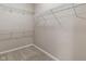 Uncluttered walk-in closet with carpet flooring and adjustable wire shelving at 12820 University Cres # 2D, Carmel, IN 46032