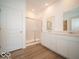 Modern bathroom featuring double sinks, a large shower, and wood look floors at 273 Lar Lan Dr, Danville, IN 46122