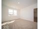 Bright bedroom with a view of the lawn through a large window at 273 Lar Lan Dr, Danville, IN 46122