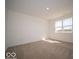 Bright bedroom featuring neutral carpet and large window overlooking the lawn at 273 Lar Lan Dr, Danville, IN 46122