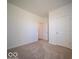 Bedroom featuring neutral carpet and a bright white door at 273 Lar Lan Dr, Danville, IN 46122