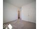 Neutral bedroom with plush carpet and a view of the hallway and doorway at 273 Lar Lan Dr, Danville, IN 46122