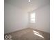 Bright bedroom with plush carpet and natural light shining through the window at 273 Lar Lan Dr, Danville, IN 46122
