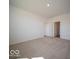 Comfortable bedroom featuring neutral carpet and an en suite bathroom at 273 Lar Lan Dr, Danville, IN 46122