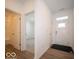 Bright entryway with hardwood floors and views of a bedroom and bathroom at 273 Lar Lan Dr, Danville, IN 46122