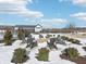 Outdoor fire pit area with Adirondack chairs surrounded by snowy landscaping on a sunny day at 273 Lar Lan Dr, Danville, IN 46122