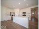 Kitchen with stainless steel appliances, island, and white cabinets at 273 Lar Lan Dr, Danville, IN 46122