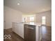 Bright, open kitchen features a large island with stainless steel dishwasher and sink at 273 Lar Lan Dr, Danville, IN 46122