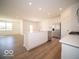 Open concept kitchen features an island with stainless steel appliances at 273 Lar Lan Dr, Danville, IN 46122