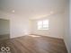 Bright living room featuring a window for natural light and hard surface floors at 273 Lar Lan Dr, Danville, IN 46122