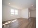 Open-concept living room featuring a bright window and hard surface floors at 273 Lar Lan Dr, Danville, IN 46122