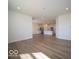 Open concept living room leading to the kitchen with hard surface floors at 273 Lar Lan Dr, Danville, IN 46122