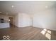 Living room and kitchen with open concept floor plan and hard surface floors at 273 Lar Lan Dr, Danville, IN 46122