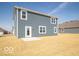 Backyard features a patio and a partial view of the exterior at 287 Lar Lan Dr, Danville, IN 46122