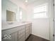 Bathroom featuring a double sink vanity with a white countertop and gray cabinets at 287 Lar Lan Dr, Danville, IN 46122
