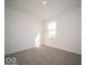 Comfortable bedroom with neutral carpet, a window for natural light, and ample space for relaxation at 287 Lar Lan Dr, Danville, IN 46122