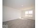 Bright bedroom features neutral carpet, a window, and light walls at 287 Lar Lan Dr, Danville, IN 46122
