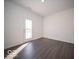 Bright dining area with hardwood floors and a glass door leading to the backyard, perfect for entertaining at 287 Lar Lan Dr, Danville, IN 46122