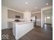 Spacious kitchen with gray cabinets, stainless steel appliances, and a large island with a white countertop at 287 Lar Lan Dr, Danville, IN 46122