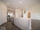 Open kitchen with gray cabinets, a large island, stainless steel appliances, and hardwood floors for easy living at 287 Lar Lan Dr, Danville, IN 46122