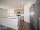 Modern kitchen features gray cabinets, stainless steel appliances, and a large center island for food preparation at 287 Lar Lan Dr, Danville, IN 46122