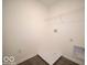 Small laundry room with wood-look floors and hookups for a washer and dryer at 287 Lar Lan Dr, Danville, IN 46122