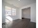 Bright living room with large windows and hardwood floors, offering a view of the neighborhood at 287 Lar Lan Dr, Danville, IN 46122