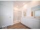 Bathroom with double sinks, white cabinets, and a walk-in shower at 301 Lar Lan Dr, Danville, IN 46122