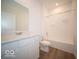 Clean bathroom with white cabinetry, modern fixtures, and a shower-tub combination at 301 Lar Lan Dr, Danville, IN 46122