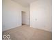 This bedroom includes neutral carpet, a closet, and an entry doorway at 301 Lar Lan Dr, Danville, IN 46122