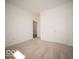 Carpeted bedroom with a view into the hallway and closet space at 301 Lar Lan Dr, Danville, IN 46122