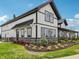 Modern clubhouse with black and white exterior, surrounded by lush landscaping at 301 Lar Lan Dr, Danville, IN 46122