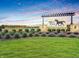 Miles Farm community entrance featuring beautiful landscaping and signage at 301 Lar Lan Dr, Danville, IN 46122