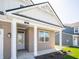 Welcoming entryway with white columns and a gray front door at 301 Lar Lan Dr, Danville, IN 46122