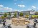 Community firepit area with seating area surrounded by landscaping and fencing at 301 Lar Lan Dr, Danville, IN 46122
