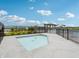 Community hot tub area with fencing around the patio and landscaping at 301 Lar Lan Dr, Danville, IN 46122