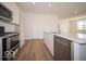 Modern kitchen featuring stainless steel appliances, white cabinets, and hardwood flooring at 301 Lar Lan Dr, Danville, IN 46122