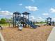 Community playground with slides, swings, and climbing structures on wood chip surface at 301 Lar Lan Dr, Danville, IN 46122