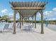 Poolside patio with pergolas offering shade over tables and chairs for outdoor lounging at 301 Lar Lan Dr, Danville, IN 46122