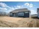 Backyard view of a home featuring multiple windows, covered patio, and grassy area at 798 Leila Mae Ln, Westfield, IN 46074
